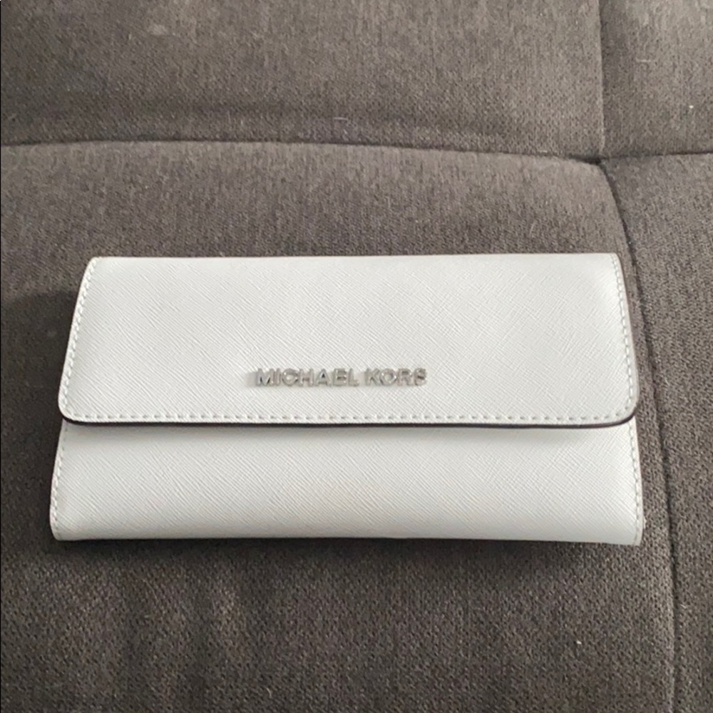White Micheal Kors trifold wallet.